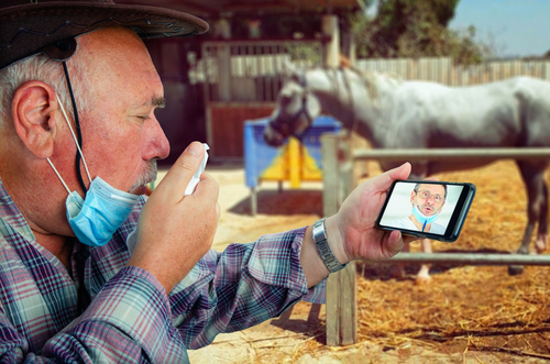 Farmer wearing mask on video call with doctor